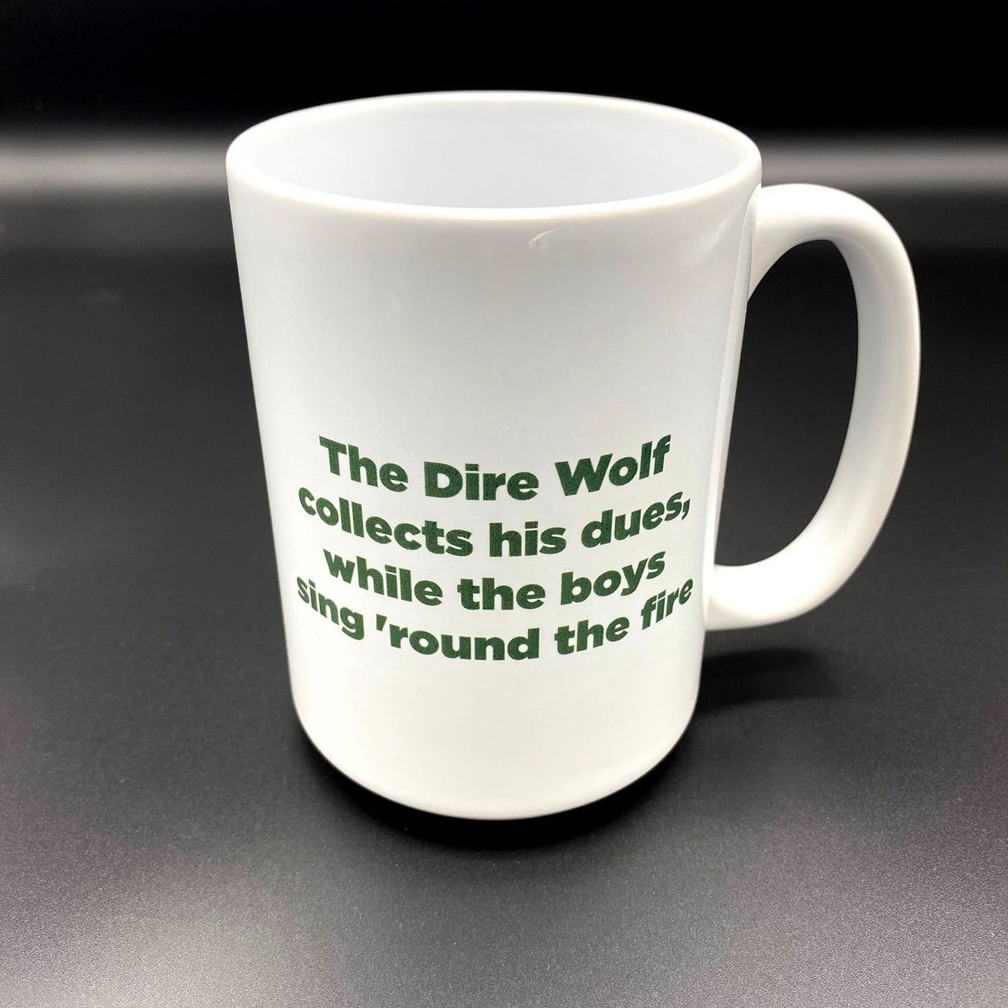 A white ceramic cup with a an image inspired by the Grateful Dead Song