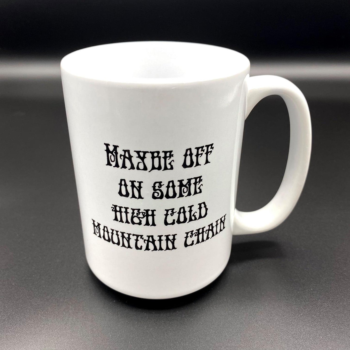 A white ceramic cup with a an image inspired by the Grateful Dead Song