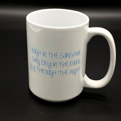 A white ceramic cup with a an image inspired by the Grateful Dead Song